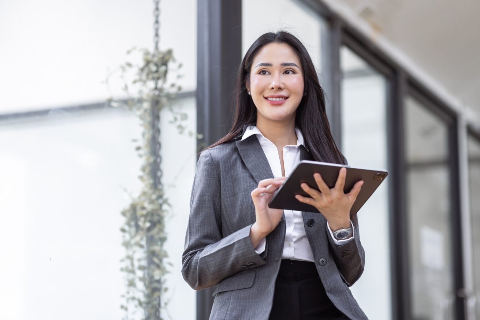 Happy,Young,Asian,Woman,,Using,Digital,Tablet,Isolated,On,Office